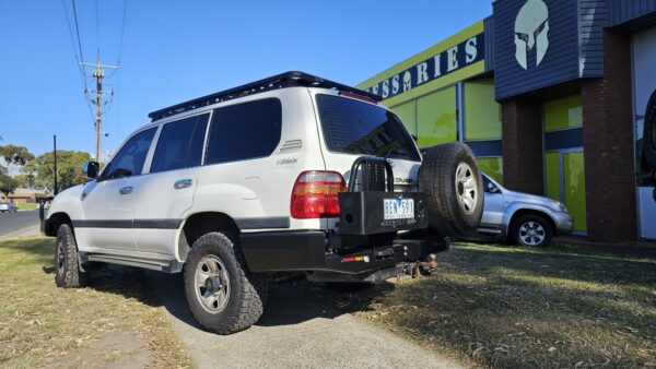 BUSHMASTER REAR CARRIER BAR LC 100 SERIES - ARMORMAN4X4